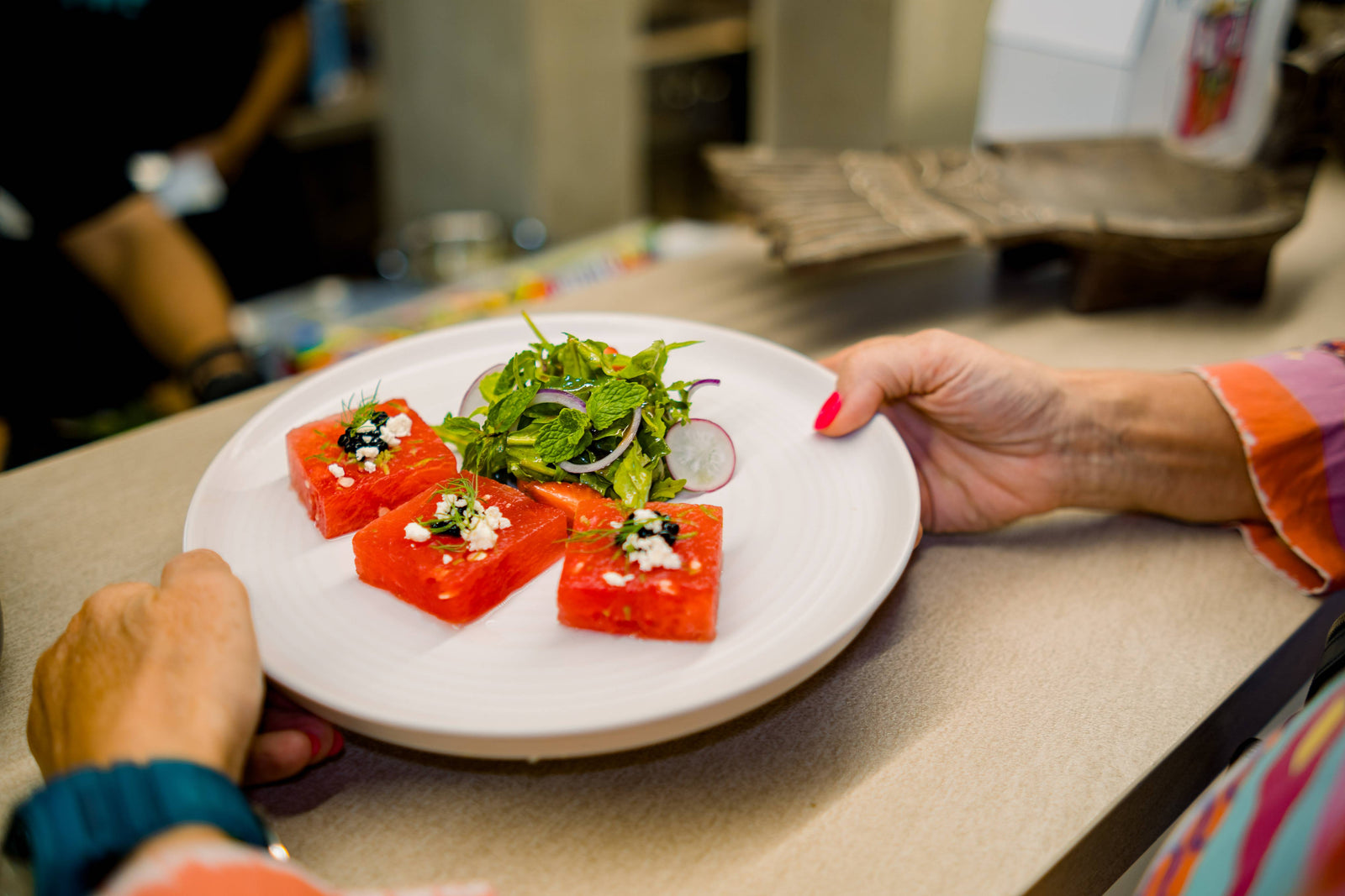 A plated dish being served