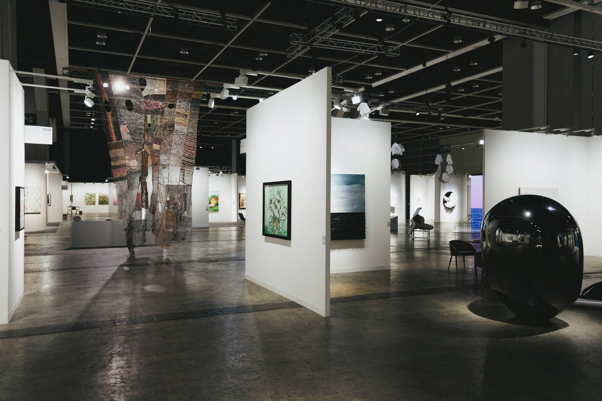 Gallery space with artworks on white walls